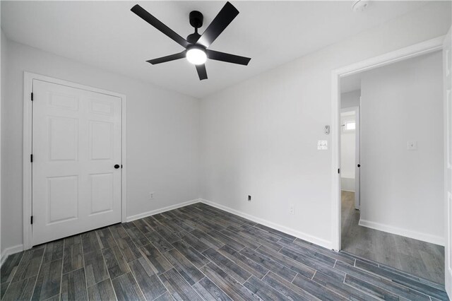 1031 Abercorn Way, Douglasville, GA 30134 - unfurnished bedroom featuring ceiling fan, dark wood finished floors, and baseboards