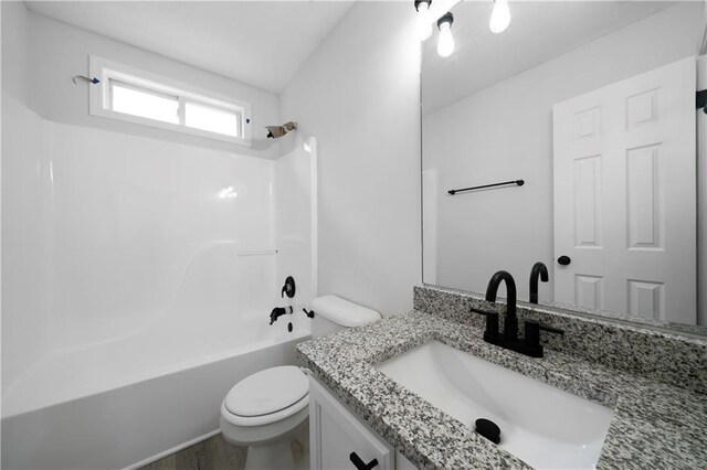 1031 Abercorn Way, Douglasville, GA 30134 - full bathroom featuring toilet, wood finished floors, bathing tub / shower combination, and vanity