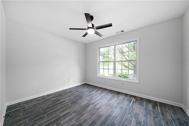 1031 Abercorn Way, Douglasville, GA 30134 - unfurnished room featuring a ceiling fan, visible vents, baseboards, and dark wood-type flooring