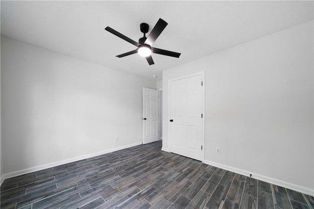 1031 Abercorn Way, Douglasville, GA 30134 - empty room with dark wood-style flooring, ceiling fan, and baseboards