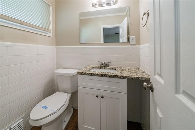 3904 W Hilda Cir, Decatur, GA 30035 - bathroom with tile walls, vanity, and wainscoting