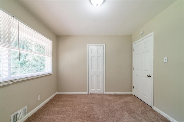 3904 W Hilda Cir, Decatur, GA 30035 - unfurnished bedroom featuring carpet flooring and a closet