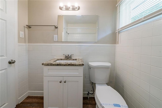 3904 W Hilda Cir, Decatur, GA 30035 - bathroom with vanity, tile walls, wainscoting, and wood finished floors
