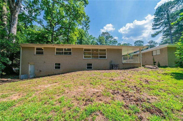 3904 W Hilda Cir, Decatur, GA 30035 - back of house with brick siding and a lawn