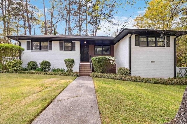 2267 Bryant Dr, East Point, GA 30344 - view of front of home with brick siding and a front yard