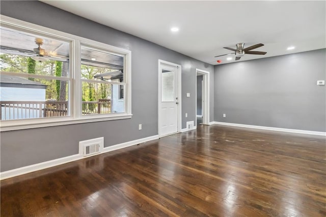 2267 Bryant Dr, East Point, GA 30344 - unfurnished living room with baseboards, a ceiling fan, wood finished floors, and visible vents