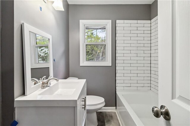 2267 Bryant Dr, East Point, GA 30344 - full bath with vanity, plenty of natural light, baseboards, and toilet