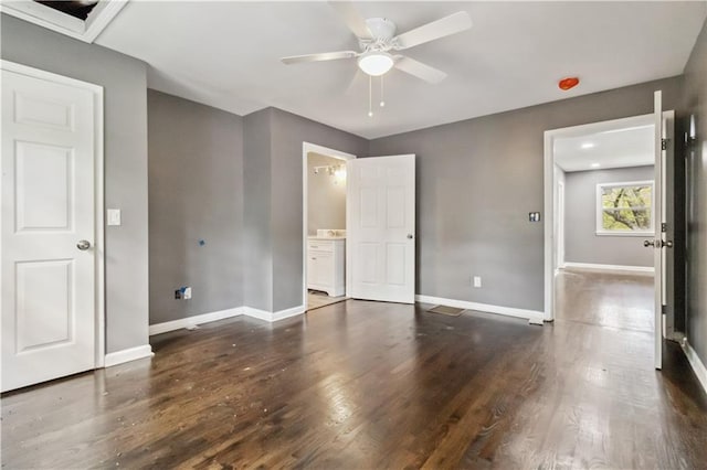 2267 Bryant Dr, East Point, GA 30344 - unfurnished bedroom with baseboards, ceiling fan, and dark wood-style flooring