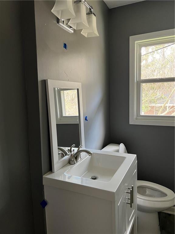 2267 Bryant Dr, East Point, GA 30344 - half bath with a healthy amount of sunlight, vanity, and toilet