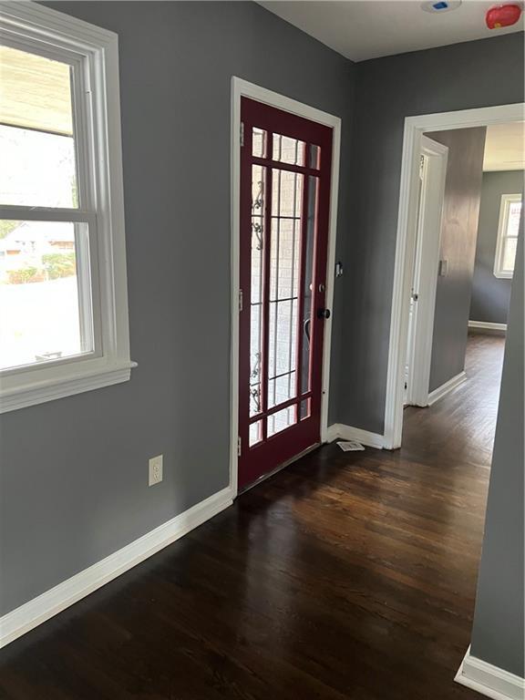 2267 Bryant Dr, East Point, GA 30344 - foyer entrance with baseboards and dark wood finished floors