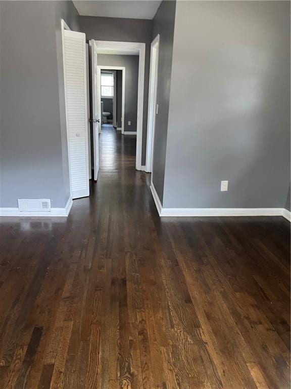 2267 Bryant Dr, East Point, GA 30344 - hallway with baseboards, dark wood-type flooring, and visible vents