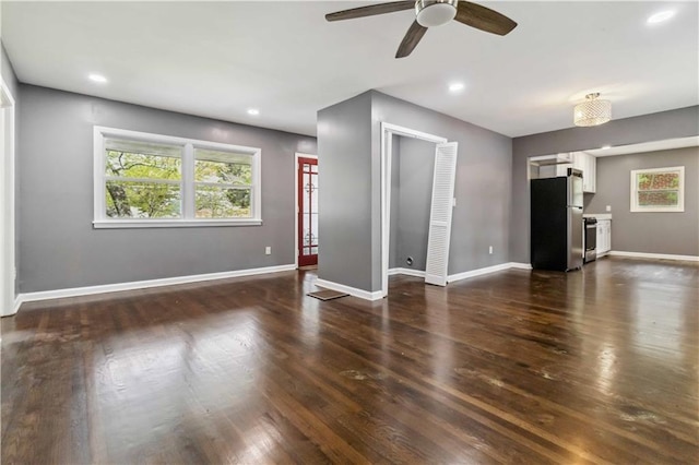 2267 Bryant Dr, East Point, GA 30344 - unfurnished living room featuring baseboards, a ceiling fan, dark wood-style flooring, and recessed lighting