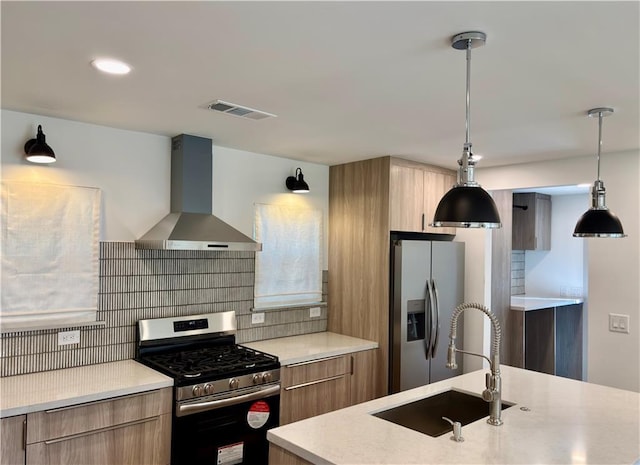 kitchen with a sink, decorative backsplash, stainless steel appliances, wall chimney exhaust hood, and modern cabinets