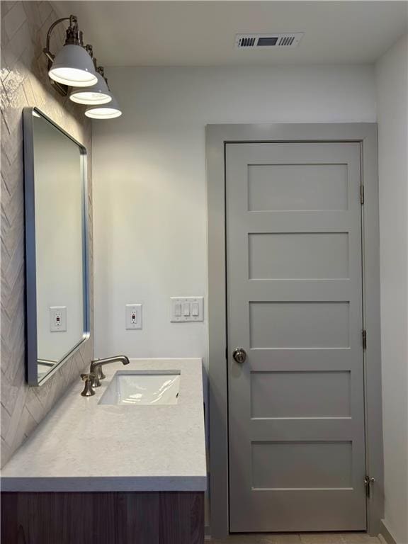 bathroom featuring visible vents and vanity