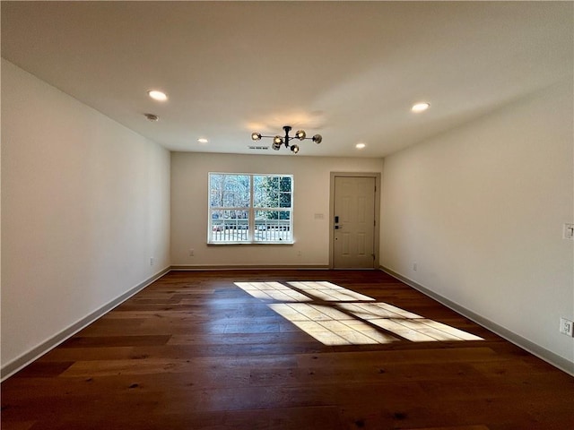 interior space featuring recessed lighting, baseboards, and wood finished floors