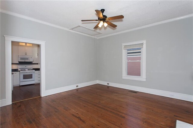 empty room with dark wood-style flooring, a ceiling fan, baseboards, and ornamental molding