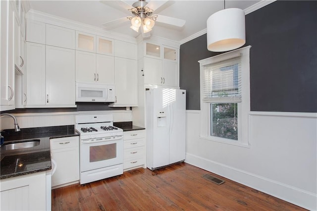 kitchen with white cabinets, a sink, white appliances, a ceiling fan, and visible vents