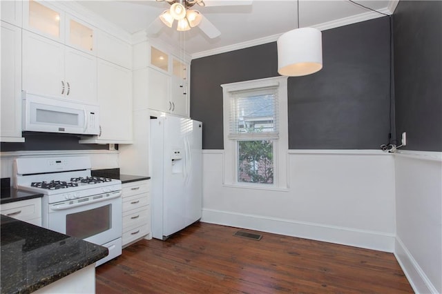 kitchen with visible vents, crown molding, dark wood-style flooring, white appliances, and ceiling fan