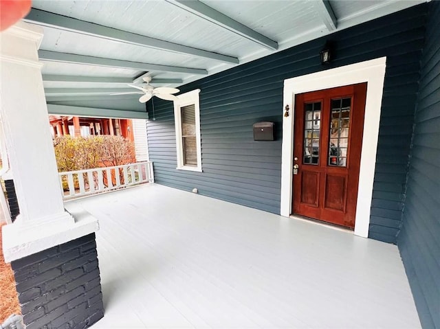 exterior space featuring a porch and a ceiling fan