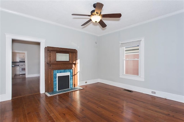 unfurnished living room featuring crown molding, a fireplace, wood-type flooring, baseboards, and visible vents