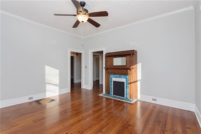 unfurnished living room with baseboards, crown molding, ceiling fan, and hardwood / wood-style floors