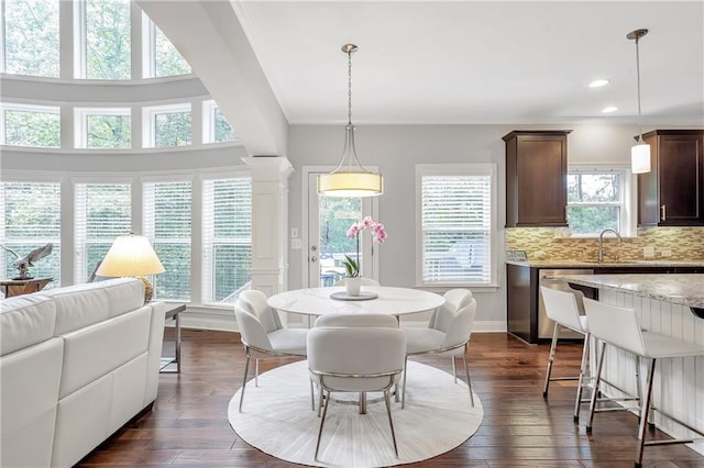 1546 Heritage Pass, Milton, GA 30004 - dining room with dark wood-style flooring, ornate columns, recessed lighting, and baseboards