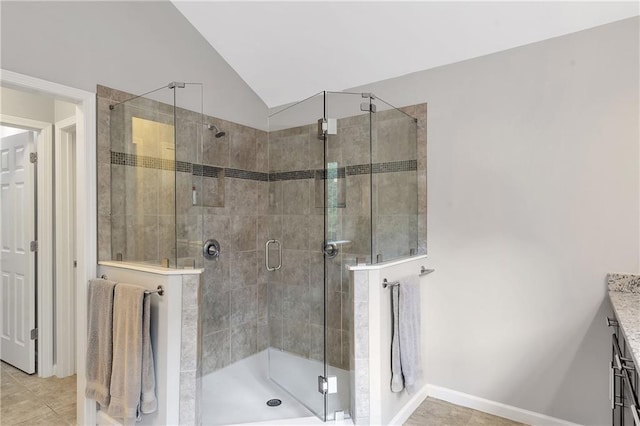 1546 Heritage Pass, Milton, GA 30004 - bathroom featuring vanity, a stall shower, lofted ceiling, and tile patterned floors