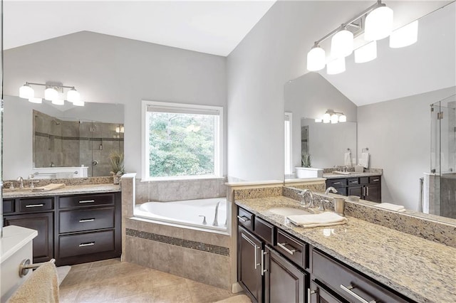 1546 Heritage Pass, Milton, GA 30004 - full bathroom with a shower stall, two vanities, a garden tub, lofted ceiling, and tile patterned floors