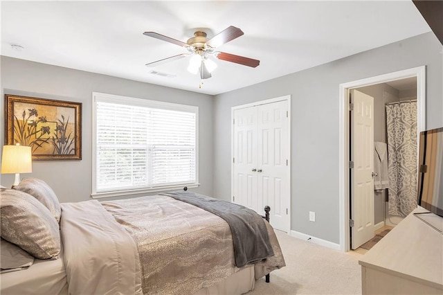 1546 Heritage Pass, Milton, GA 30004 - bedroom featuring light colored carpet, baseboards, a closet, ceiling fan, and connected bathroom