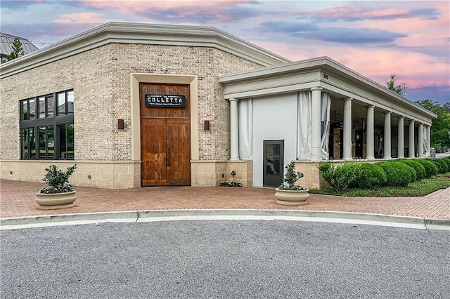 1546 Heritage Pass, Milton, GA 30004 - exterior entry at dusk featuring brick siding
