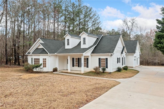 view of front of property with a porch and concrete driveway