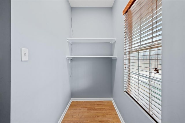 spacious closet with wood finished floors