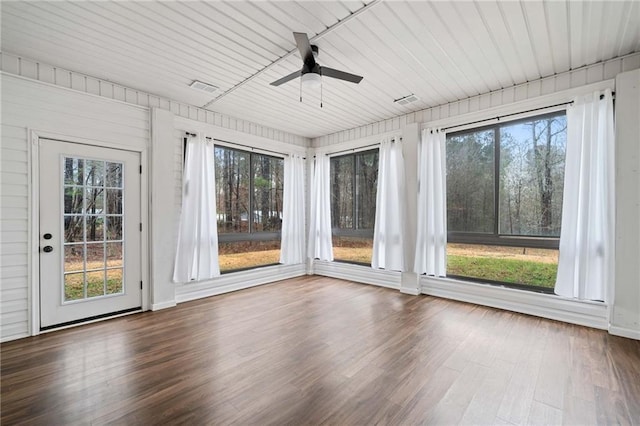 unfurnished sunroom with visible vents and a ceiling fan