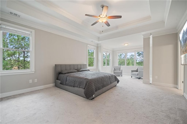 4402 Income Cir, Ellenwood, GA 30294 - carpeted bedroom featuring multiple windows, a tray ceiling, crown molding, and baseboards