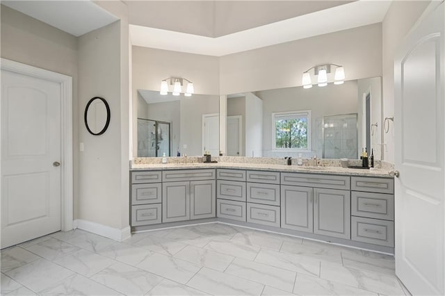 4402 Income Cir, Ellenwood, GA 30294 - bathroom with marble look tiles, a shower stall, and double vanity