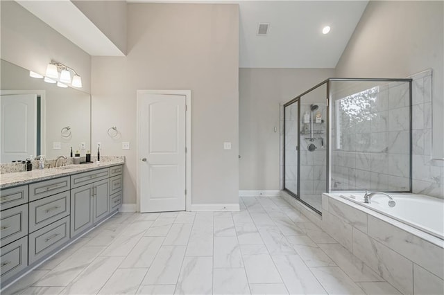 4402 Income Cir, Ellenwood, GA 30294 - bathroom featuring marble finish floors, a garden tub, double vanity, and a stall shower