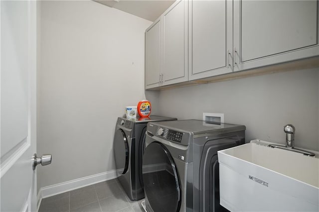 4402 Income Cir, Ellenwood, GA 30294 - washroom featuring cabinet space, independent washer and dryer, baseboards, and tile patterned flooring