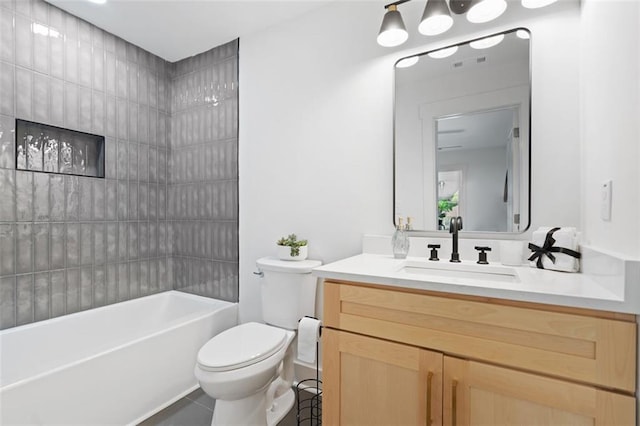 full bath featuring toilet, tile patterned flooring, vanity, and shower / bathtub combination