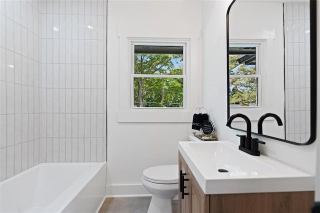 bathroom with baseboards, toilet, vanity, and tile patterned flooring