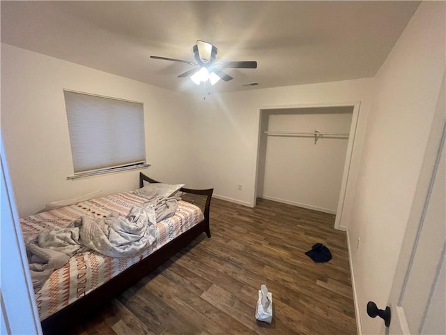 bedroom with ceiling fan, a closet, and dark hardwood / wood-style floors