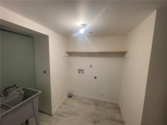 washroom featuring a textured ceiling, electric dryer hookup, sink, and hookup for a washing machine