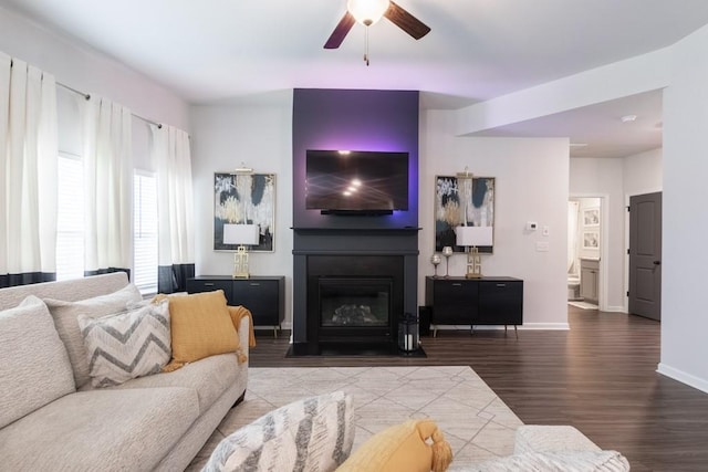 4824 Sultana Way SW, Atlanta, GA 30331 - living room featuring wood finished floors, a glass covered fireplace, baseboards, and ceiling fan