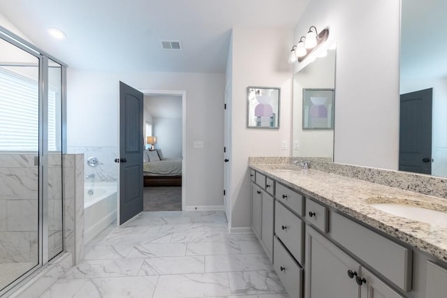 4824 Sultana Way SW, Atlanta, GA 30331 - ensuite bathroom featuring marble finish floor, a sink, a garden tub, visible vents, and double vanity