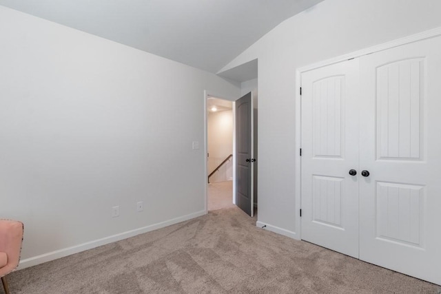 4824 Sultana Way SW, Atlanta, GA 30331 - unfurnished bedroom with a closet, carpet floors, baseboards, and vaulted ceiling