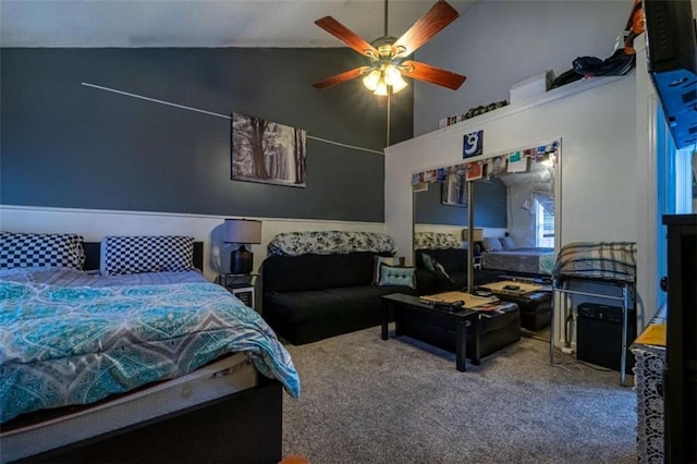 bedroom with carpet flooring, a ceiling fan, and high vaulted ceiling