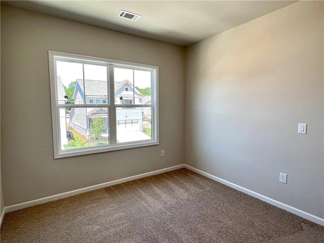 unfurnished room with carpet flooring