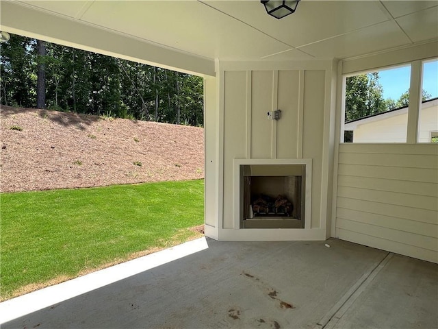 view of patio with exterior fireplace