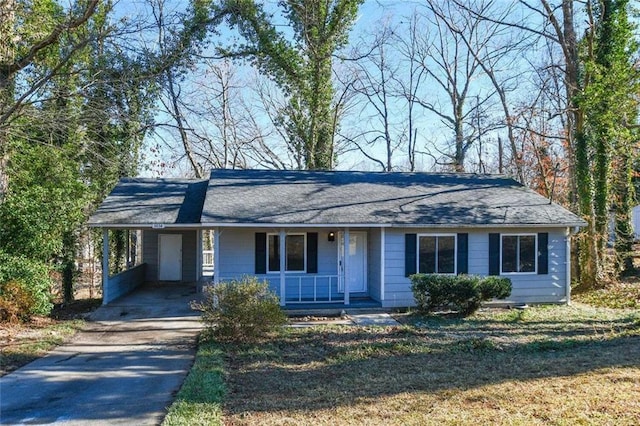 single story home with a carport and covered porch