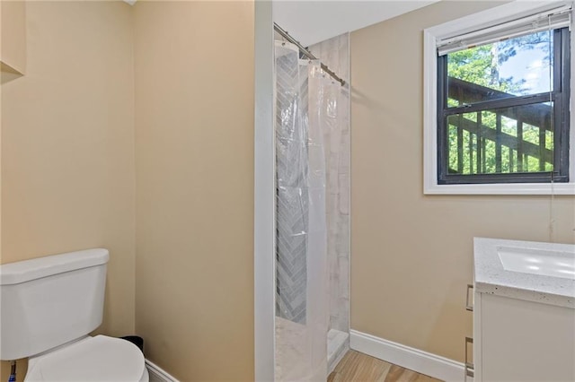 4811 Nevilly Way, Marietta, GA 30066 - bathroom featuring baseboards, toilet, a tile shower, and vanity