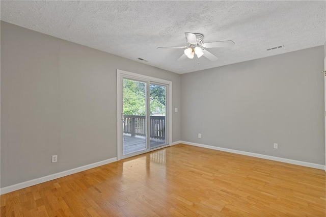 4811 Nevilly Way, Marietta, GA 30066 - spare room with a textured ceiling, visible vents, ceiling fan, baseboards, and light wood-type flooring